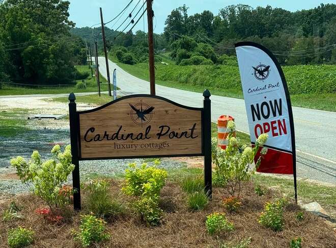 The Cardinal Point Luxury Cottages entrance sign